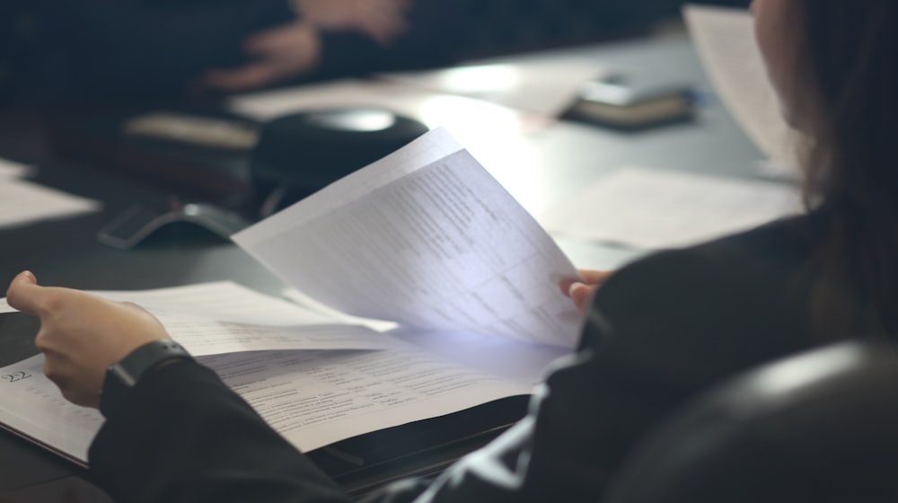 Printed documents being reviewed on a desk